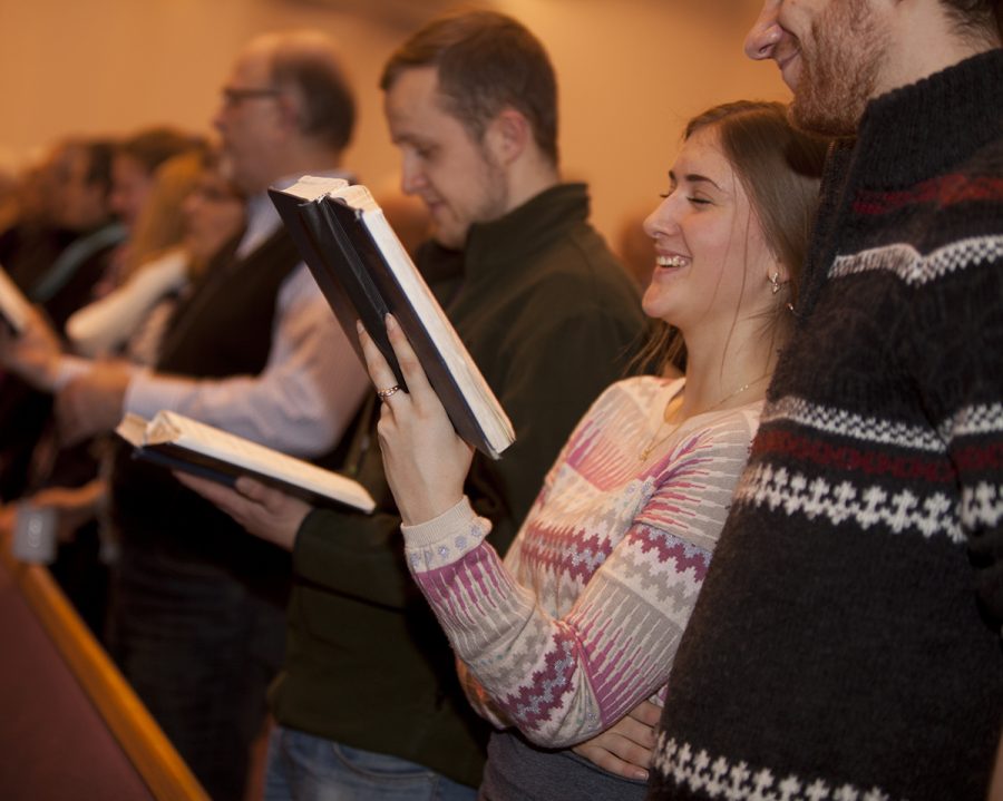 Valeriia joins in the singing at Bethel Mennonite Church.