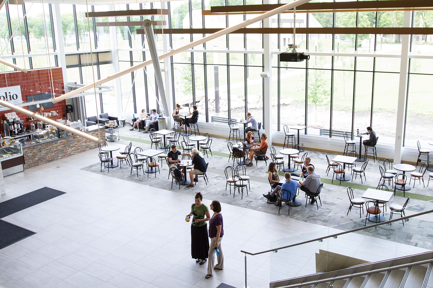 6 study tips — A view of Marpeck Commons from the Mezzanine level, down to the tables and chairs below, with Folio Cafe and the wall of glass letting in so much natural light.