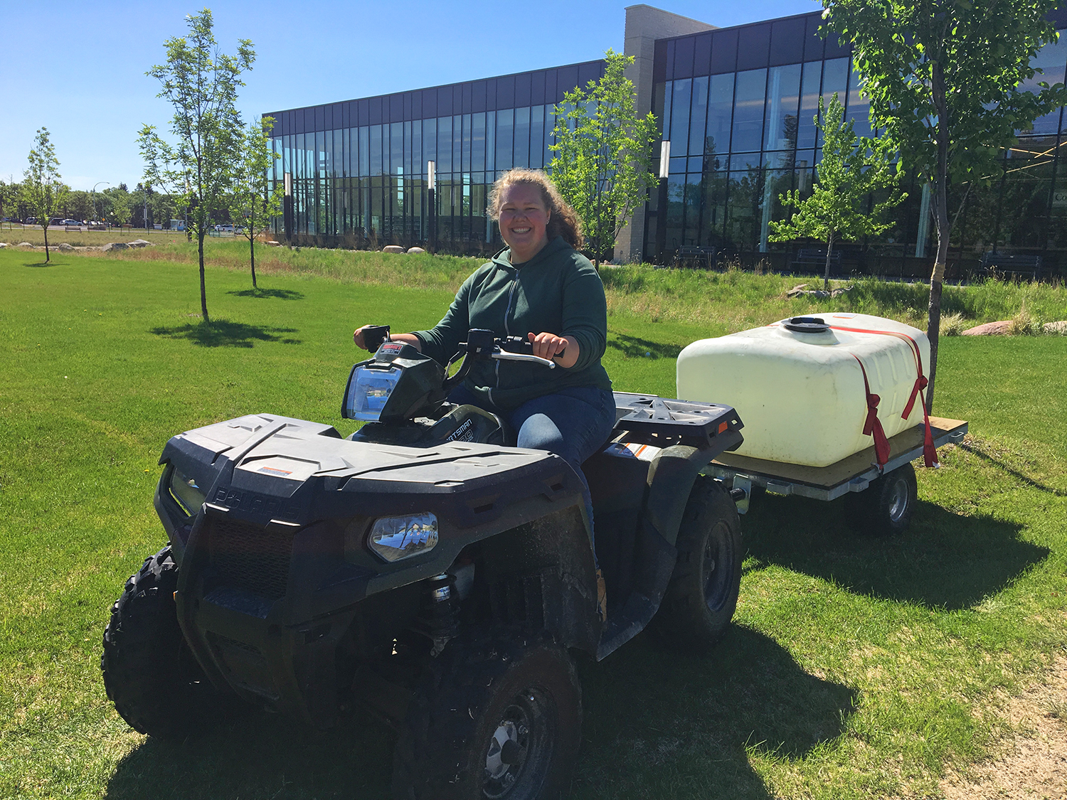 Summer jobs: On-campus employment at CMU. Rebecca Janzen rides 'the quad' for her summer job as a groundskeeper at CMU.