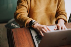 hands at a laptop